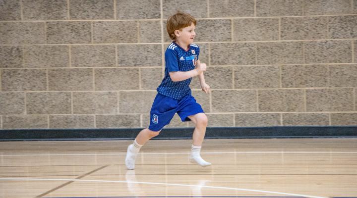 Kid running in gym