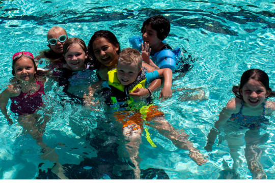 Kids and girl in pool